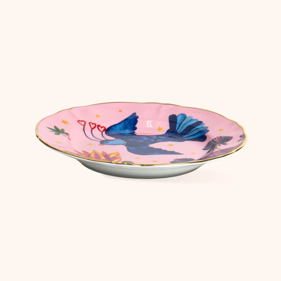 Piatto Frutta Profumo Uccellino Bitossi Home vista laterale con fondo rosa e bordo dorato